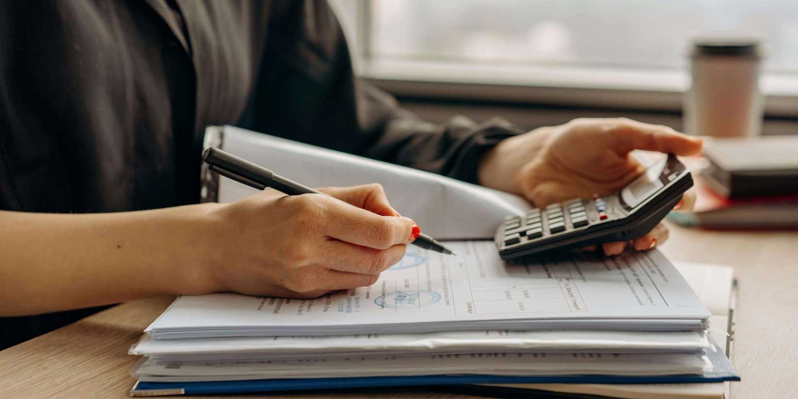 HS-Lady-with-calculator-and-documents