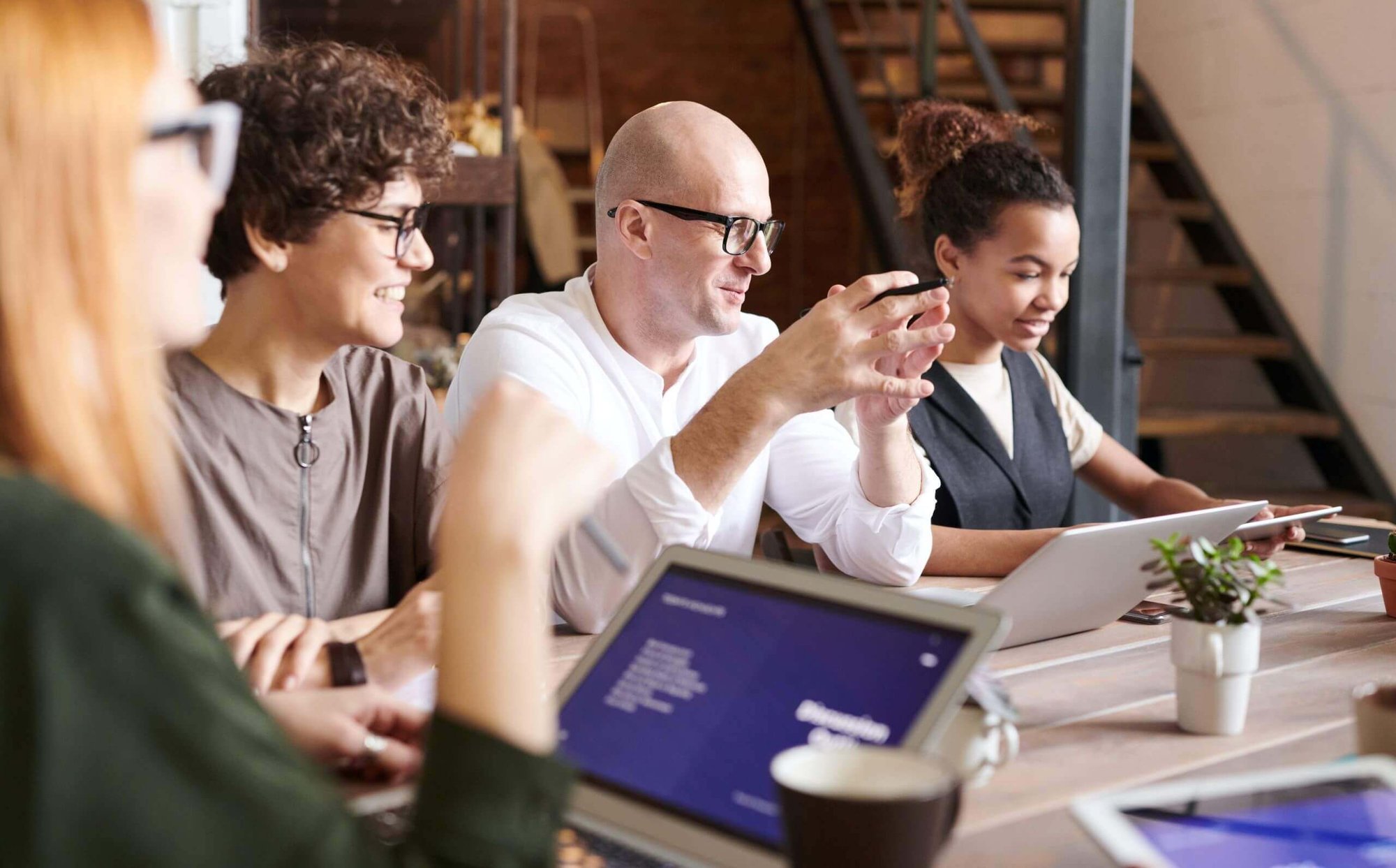 Team working together at a table-1 Team working together at a table-1