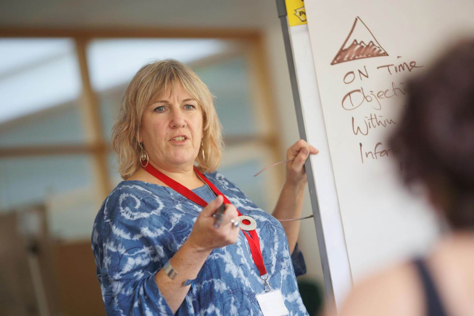 Woman at white board