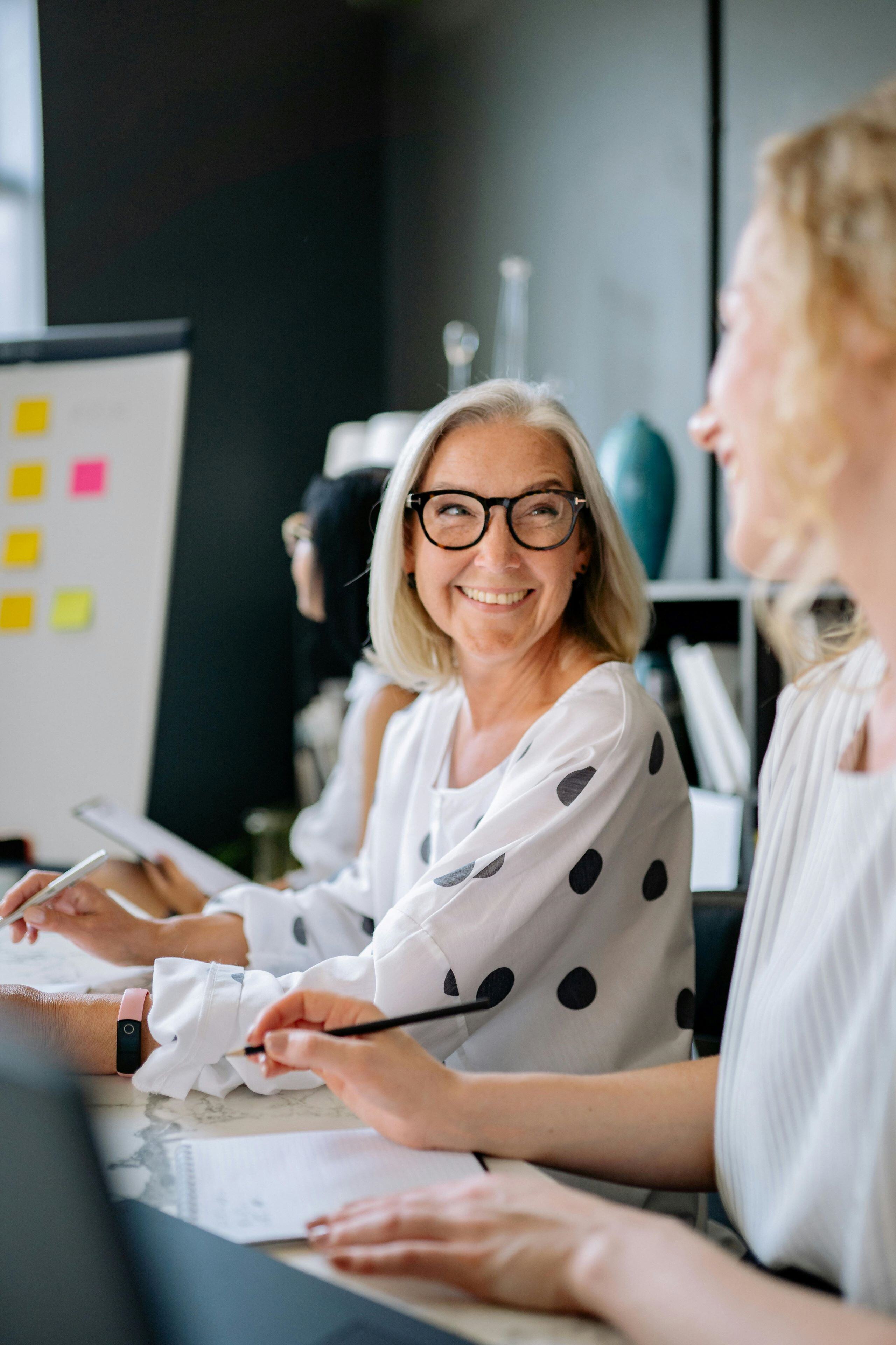 Woman smiling in strategy meeting